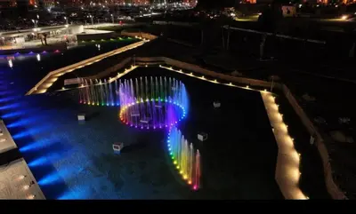 a pool with lights in the water at night at Shell Maqueda in Palermo