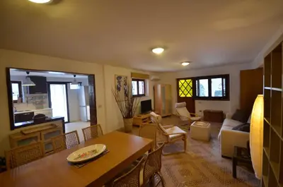 a living room with a table and a couch at Casa Garofani in Carini
