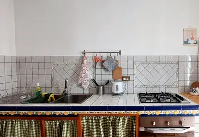 a kitchen with a sink and a stove at Casa Santoliva in centro a Palermo in Palermo
