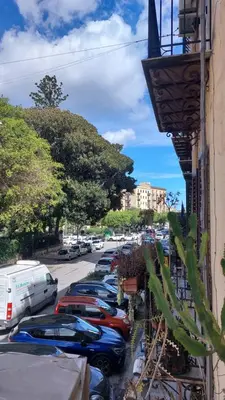a row of cars parked in a parking lot at Casa Santoliva in centro a Palermo in Palermo