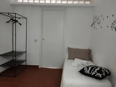 a bedroom with a bed with a glass door at Appartamento centro storico.(Nina's house Venezia) in Palermo