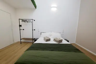 a bedroom with a bed with two towels on it at Argenteria5 Holiday Rooms in Palermo