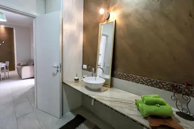 a bathroom with a sink and a mirror at Casa Le Nereidi in Castellammare del Golfo