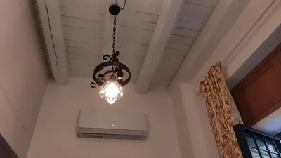 a chandelier hanging from a ceiling in a room at Holiday Home Celsus 84 in Palermo
