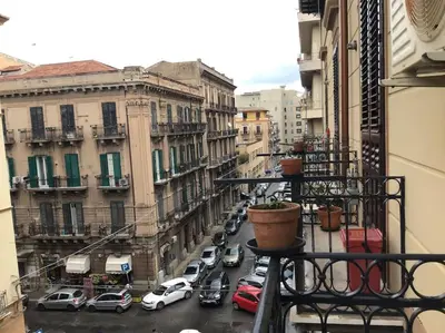 a view of a city street with cars parked at Appartamento Alessandro al porto in Palermo