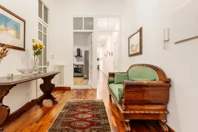 a framed picture of a hat on a table at Cicco's Home - Holidays Apartment in Palermo