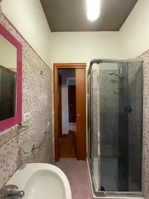 a bathroom with a shower and a sink at La Villetta di Sofia in Carini