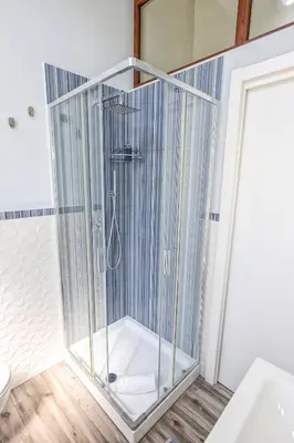a shower with a glass enclosure in a bathroom at Il Bel Canto - Suite in centro storico in Palermo