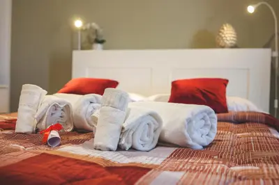 a group of towels on top of a bed at Il Bel Canto - Suite in centro storico in Palermo