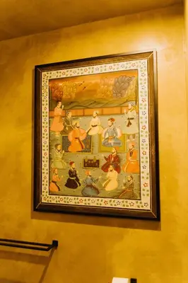 a framed picture of a painting on a wall at QUIETE e MARE in San Vito lo Capo