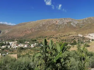 a view of a town in front of a mountain at Villa Francesca in Castelluzzo