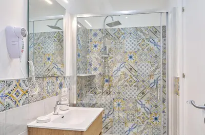 a bathroom with a sink and a shower at Vista Mare Rooms in Isola delle Femmine