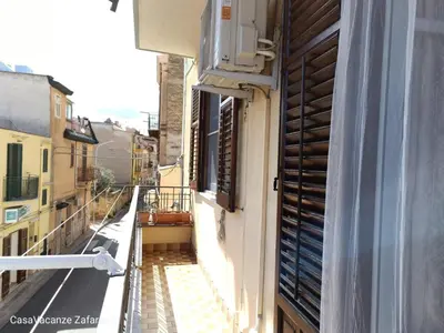 an apartment balcony with a view of a street at Casa Vacanze Zafarana in Santa Flavia