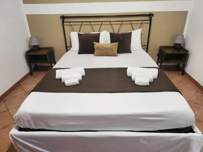 a bedroom with a large bed with towels on it at Maison M&M in Palermo