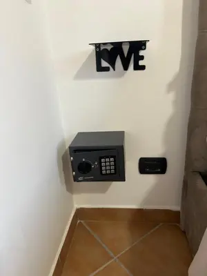 a pay phone on the wall of a room at MAESTRALE CASA VACANZA in Isola delle Femmine