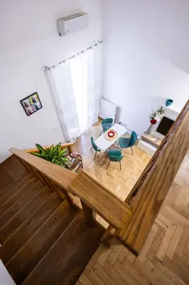 an overhead view of a living room with a table and chairs at Noble Suite in Palermo
