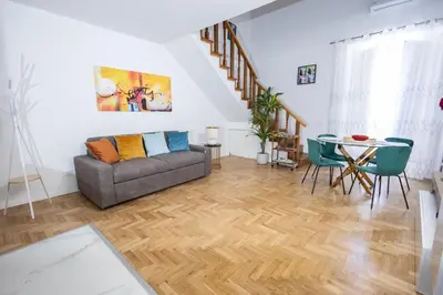 a living room with a couch and a table at Noble Suite in Palermo