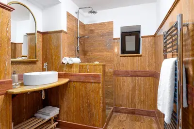 a bathroom with a sink and a shower at Behind the Cathedral apt in Palermo