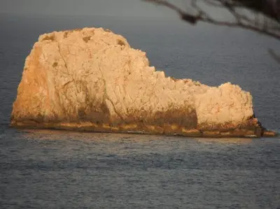 a large rock in the middle of the water at Case Giannone in Santa Flavia