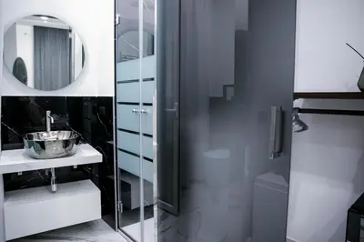 a bathroom with a sink and a mirror at Suite del Principe - Prince's Suite. in Palermo