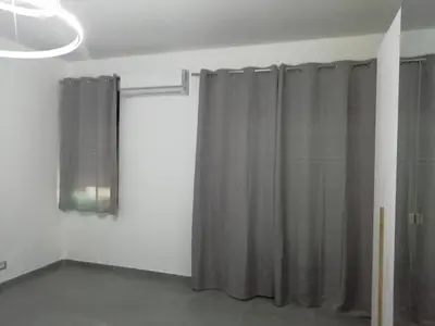 a room with a shower curtain and a window at Casa Nino' in Palermo