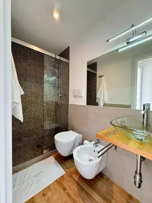 a kitchen with a sink and a large window at N&L Apartments Palermo in Palermo