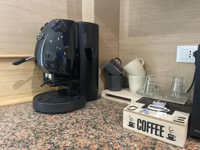 a computer monitor sitting on a counter with a box at La Riva - Seashore in Bagheria