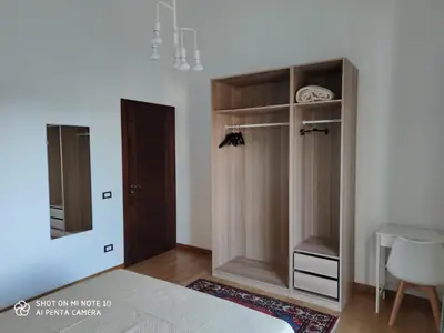 a bedroom with a closet with a mirror and a bed at Casa Anna in Carini