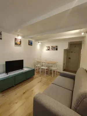 a living room with a couch and a table at Casa di Tommy in Palermo