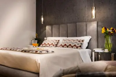 a bedroom with a large bed with two pillows at Ducrot Apartment in Palermo