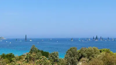 a large body of water with boats in the water at Mondello Luxury Apartment in Palermo