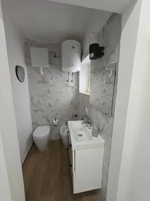 a white bathroom with a sink and a toilet at Virginia House1 in Palermo