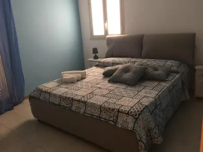 a bedroom with a bed with two pillows on it at Villa Priscilla in Cinisi