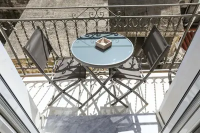a living room with a couch and a table at Gioiamia Luxury Apartment in Palermo