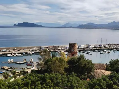 a view of a marina with boats in the water at RineddaHouse Arenella - Vista Mare Panoramica a Palermo con Parcheggio privato in Palermo