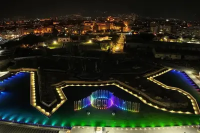 a view of the city at night at Molo Five Apartment in Palermo