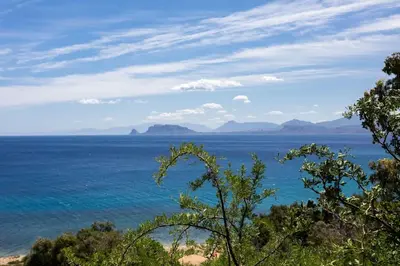 a view of the ocean with mountains in the distance at Panoramic apartment on the beach A/C in Palermo