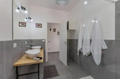 a bathroom with a sink and a toilet at Panoramic apartment on the beach A/C in Palermo