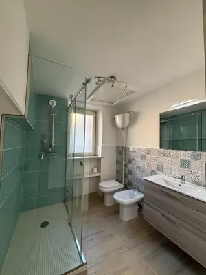 a bathroom with a shower and a toilet and a sink at Ospiti a casa mia in Palermo