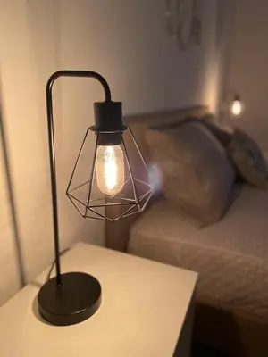 a lamp sitting on a table next to a couch at Licia's home in Palermo