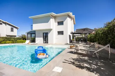 a house with a swimming pool with a inflatable raft at Luxury villa Taravilla with pool in Altavilla Milicia