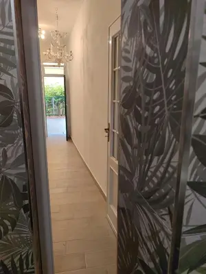 a hallway with a door leading into a room at L'Arco Verde San Nicola l'Arena in Trabia