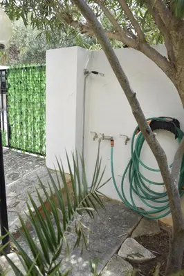 a green cabinet with a window in a room at Da Silvia, a due passi dal mare in San Vito lo Capo