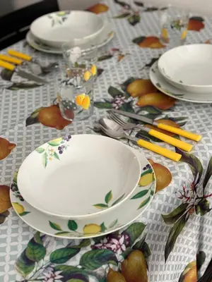 a table topped with plates and bowls on a table at Come fossi a casa in Palermo