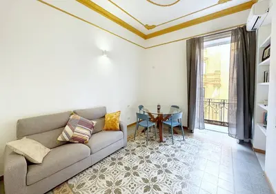 a living room with a couch and a table at Solemar Sicilia - Casa Markiz in Palermo