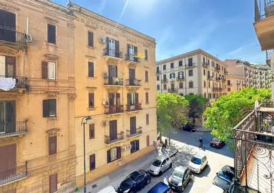 an overhead view of a city street with cars parked in front of buildings at Solemar Sicilia - Casa Markiz in Palermo