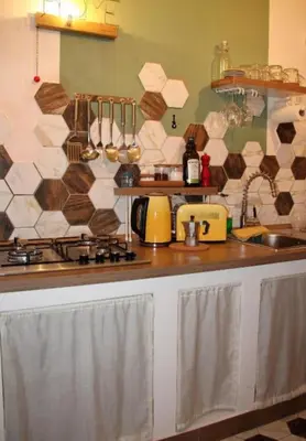 a kitchen with a sink and a counter top at Porta delle Stelle Vucciria in Palermo