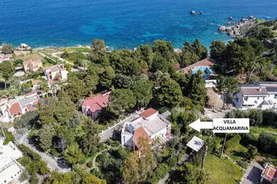 an aerial view of a house and the ocean at Villa Acquamarina - 300 meters from the sea in Scopello