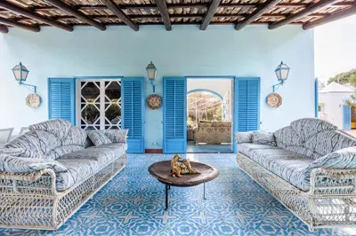 a living room with two couches and a table at Mille e Una Notte By Domus Sicily in Mondello