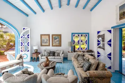 a living room with couches and chairs at Mille e Una Notte By Domus Sicily in Mondello